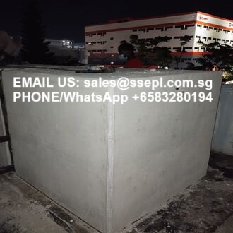 Concrete barrier at night displaying contact info: Email sales@ssepl.com.sg, Phone/WhatsApp +6583280194.