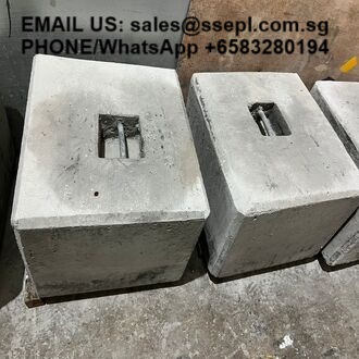 Three gray concrete blocks with metal inserts on a rough floor; black overlay text shows contact email and phone number.