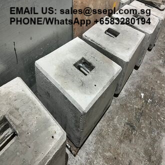Row of square concrete blocks with slots on top lined up on a concrete floor; overlaid contact text reads 'EMAIL US: sales@ssel.com.sg PHONE/WhatsApp +65 3280194' (contact info)