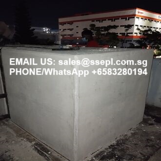 Night shot of a concrete barrier with contact info: Email sales@ssepl.com.sg and Phone/WhatsApp +65 83280194.