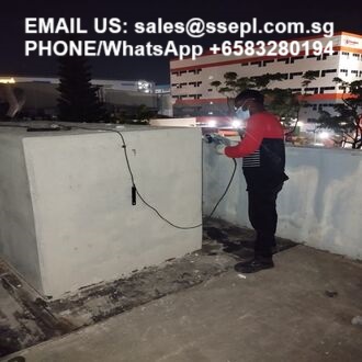Nighttime rooftop worker handling cables; image shows contact text: 'EMAIL US: sales@ssepl.com.sg PHONE/WhatsApp +6583280194'
